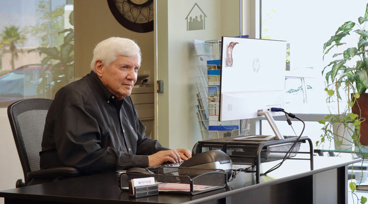 Jerry J. Goldstein working in his office